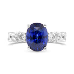 Blue Oval Sapphire and Diamond Side Stone Ring