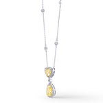 Fancy Light Yellow Pear and Triangle Drop Halo Diamond Pendant.