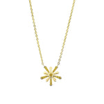 Gold necklace with a sunflower pendant on a white background