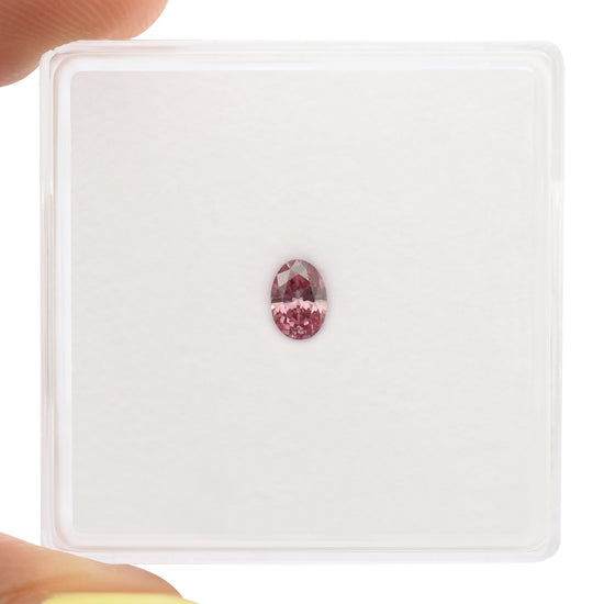 0.16 Carat Fancy Vivid Purplish Pink Oval Diamond I2 GIA