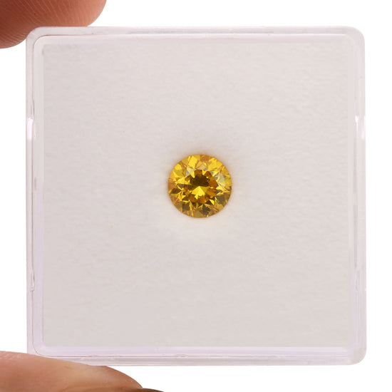 0.55 Carat Fancy Vivid Orangy Yellow Round Diamond SI1 GIA