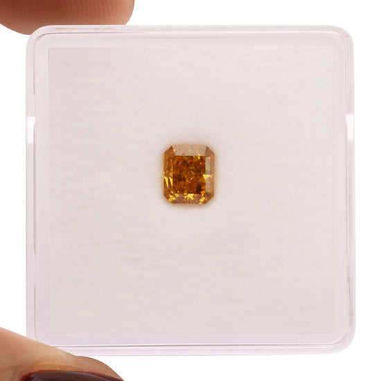 0.56 Carat Fancy Vivid Orange Radiant Diamond SI2 GIA