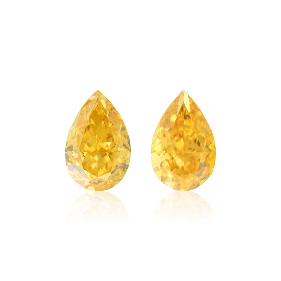 0.64 Carat Fancy Vivid Orange Yellow Pear Diamonds SI1 GIA Pair