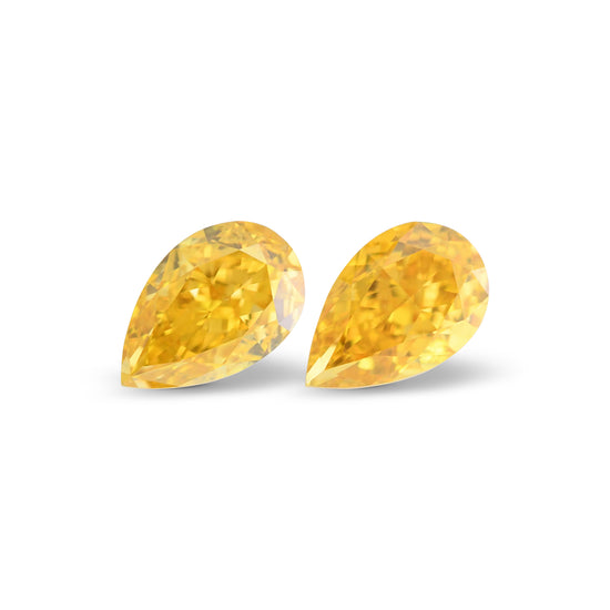 0.64 Carat Fancy Vivid Orange Yellow Pear Diamonds SI1 GIA Pair
