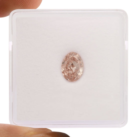 1.00 Carat Fancy Orangy Pink Oval Diamond SI2 GIA