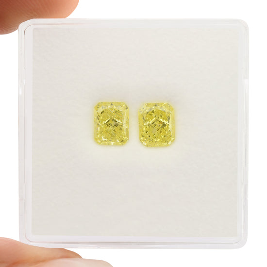 1.29 Carat Fancy Yellow Radiant Diamonds VS1 GIA Pair