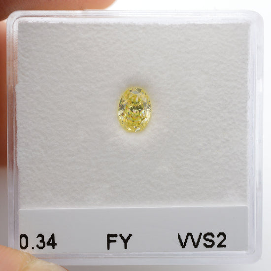 0.34 Carat Fancy Yellow Oval Diamond VVS2 IGI