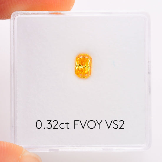 0.32 Carat Fancy Vivid Orange Yellow Radiant Diamond VS2 GIA