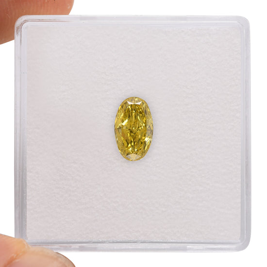 0.72 Carat Fancy Vivid Yellow Oval Diamond VVS1 GIA