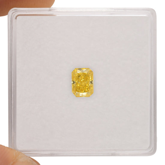 0.63 Carat Fancy Vivid Yellow Radiant Diamond SI1 GIA