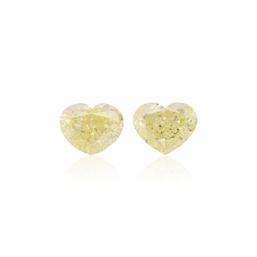 5.55 Carat Fancy Light Yellow Heart Diamonds VVS2 GIA Pair