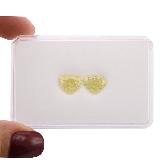5.55 Carat Fancy Light Yellow Heart Diamonds VVS2 GIA Pair