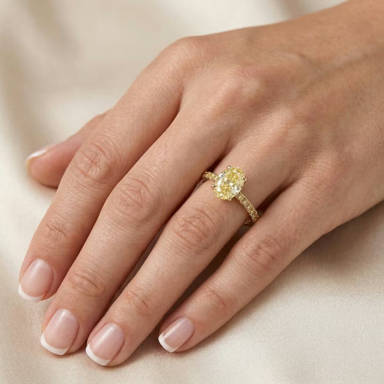 Light Yellow Oval Diamond Side Stones Ring