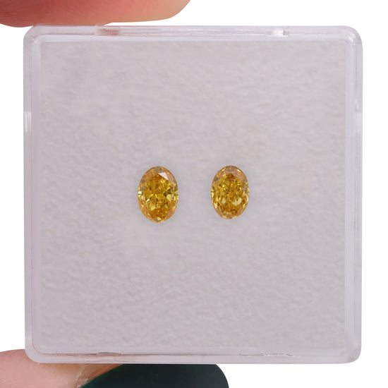 0.55 Carat Fancy Vivid Orangy Yellow Oval Diamonds VS2