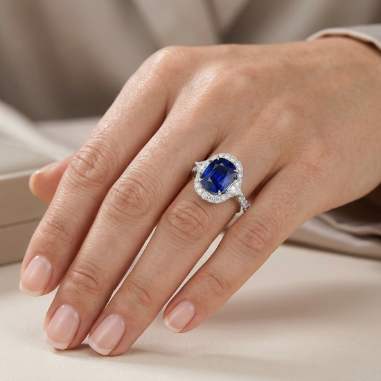 Royal Blue Cushion Sapphire & Triangle Diamond Halo Ring