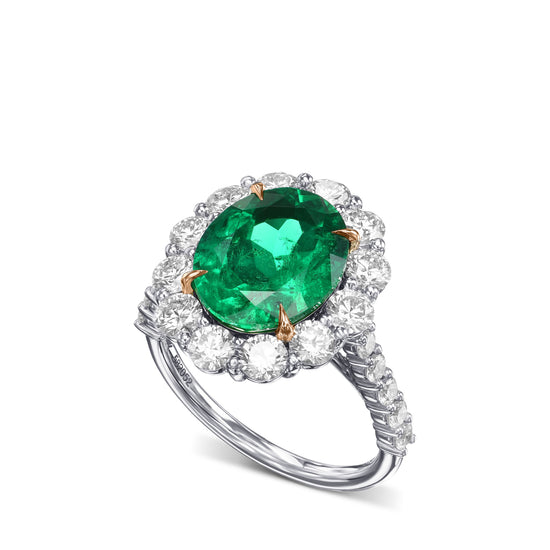 Oval Muzo Emerald and Diamond Halo Ring