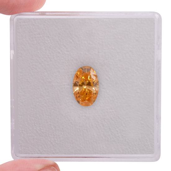 0.74 Carat Fancy Vivid Orange Oval Diamond SI2 GIA