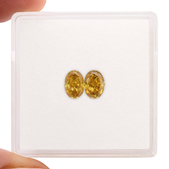 0.87 Carat Fancy Intense Orange Yellow Oval Diamonds (SI1)
