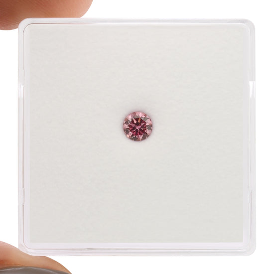 0.16 Carat Fancy Vivid Purplish Pink Round Brilliant Diamond SI1 GIA