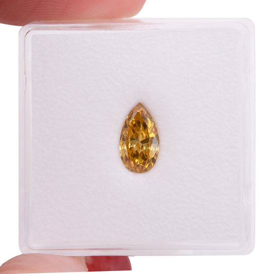 0.69 Carat Fancy Vivid Yellow Orange Pear Diamond SI2 GIA