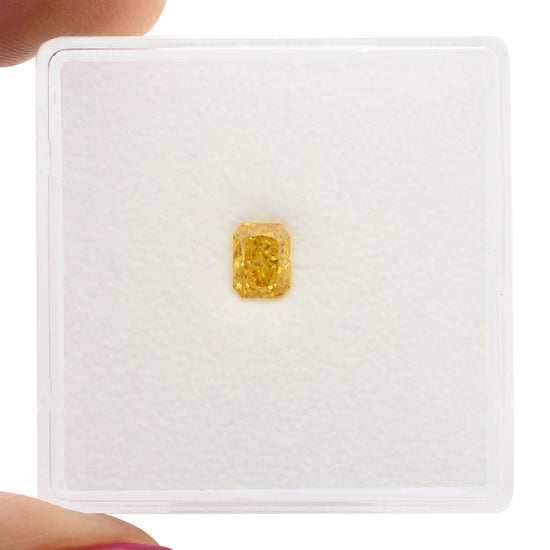 0.33 Carat Fancy Vivid Yellow Orange Radiant Diamond VVS1 GIA