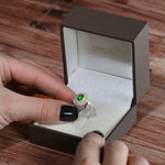 Vivid Green Emerald and Fancy Intense Yellow Diamond Ring