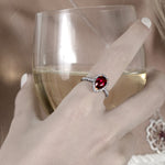 Unheated Pear Ruby and Diamond Halo Ring