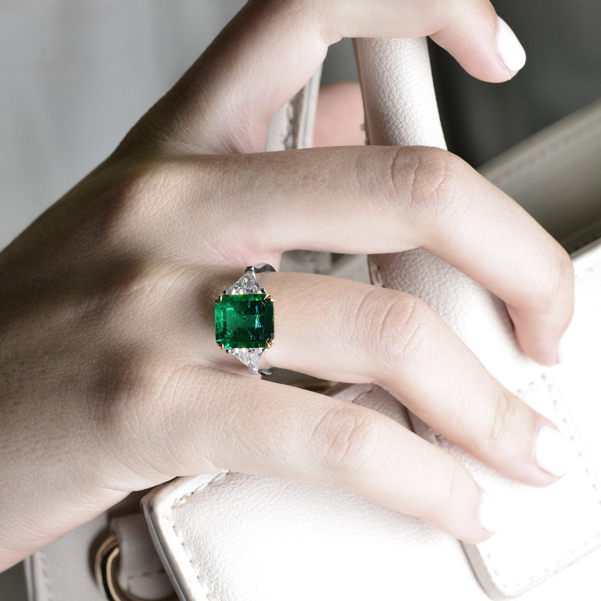 Emerald Gemstone and Triangle Diamond Ring