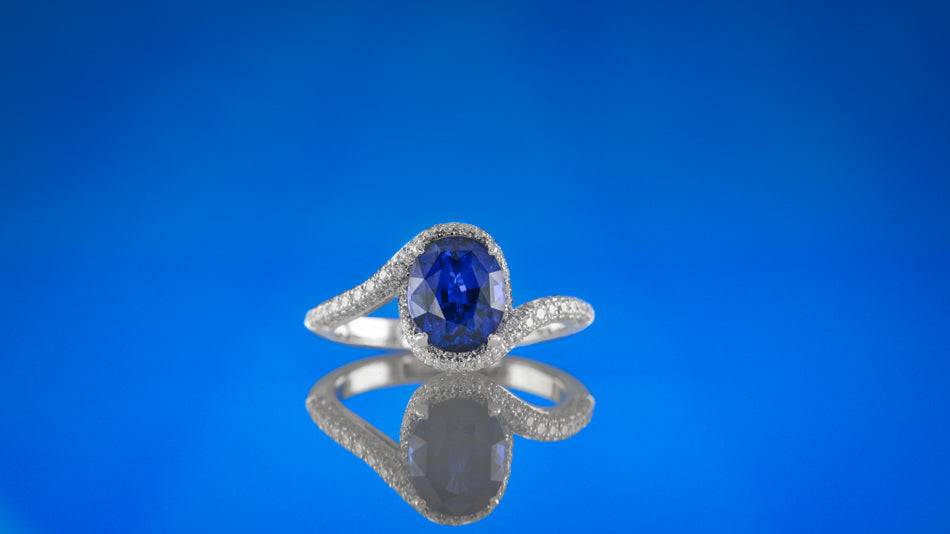 Oval Sapphire & Diamond Cross-over Halo Ring