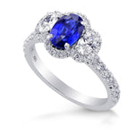  Oval Blue Sapphire and Diamond Side Stone Ring