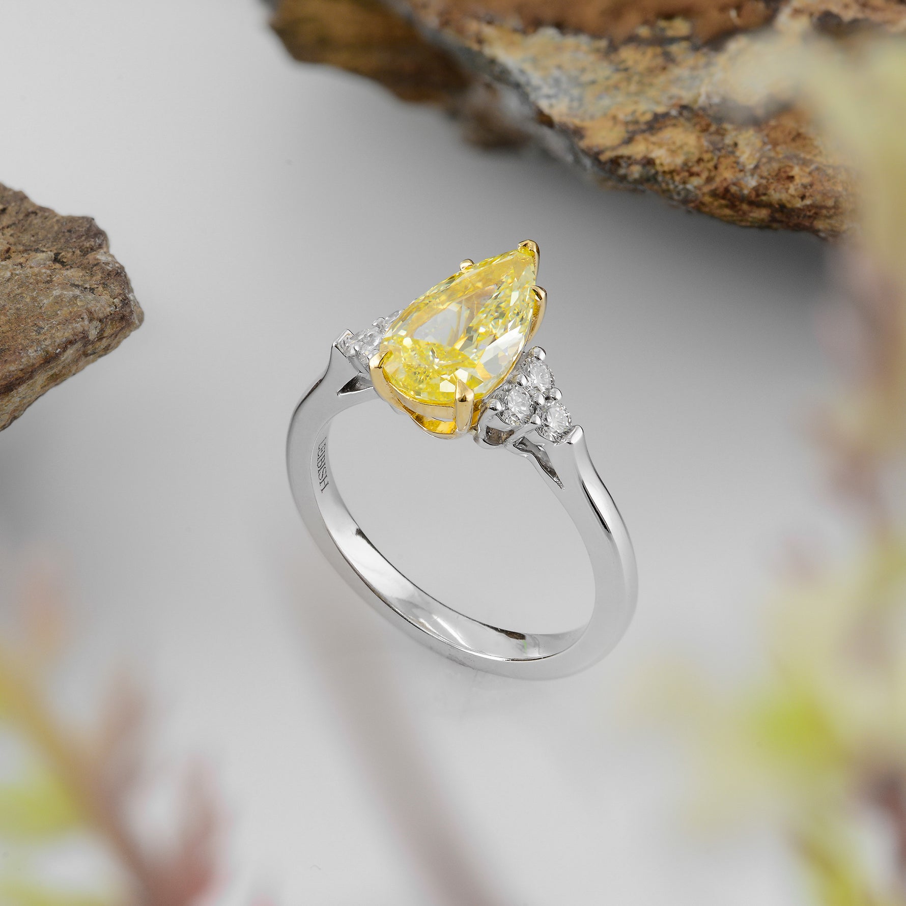 Fancy Yellow Pear Side Stone Diamond ring 