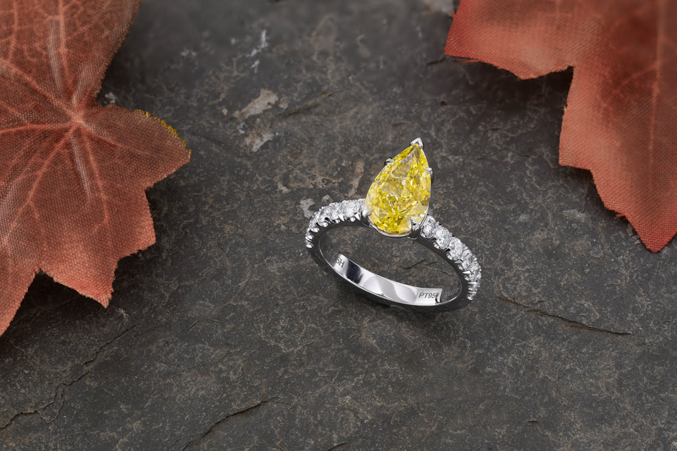 Fancy Light Yellow Pear Diamond Side Stone Ring