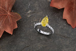 Fancy Light Yellow Pear Diamond Side Stone Ring