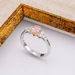 Fancy Intense Pink Oval Diamond Side Stone Ring