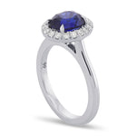 Oval Royal Blue Sapphire and Diamond Halo Ring
