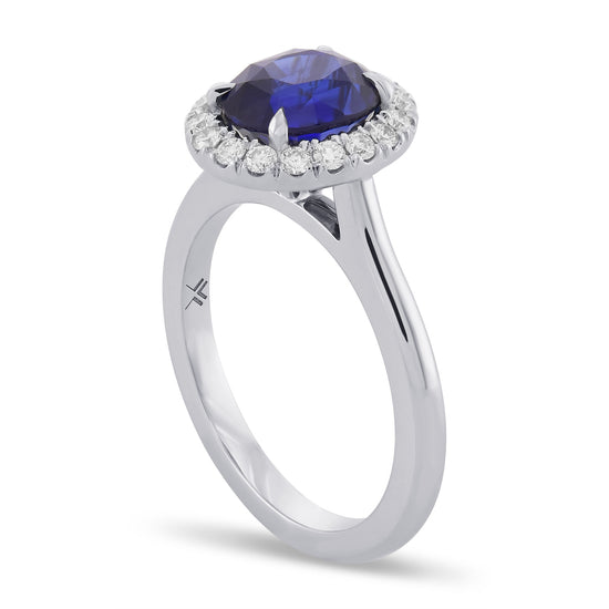 Oval Royal Blue Sapphire and Diamond Halo Ring