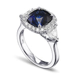 Royal Blue Cushion Sapphire & Triangle Halo Ring