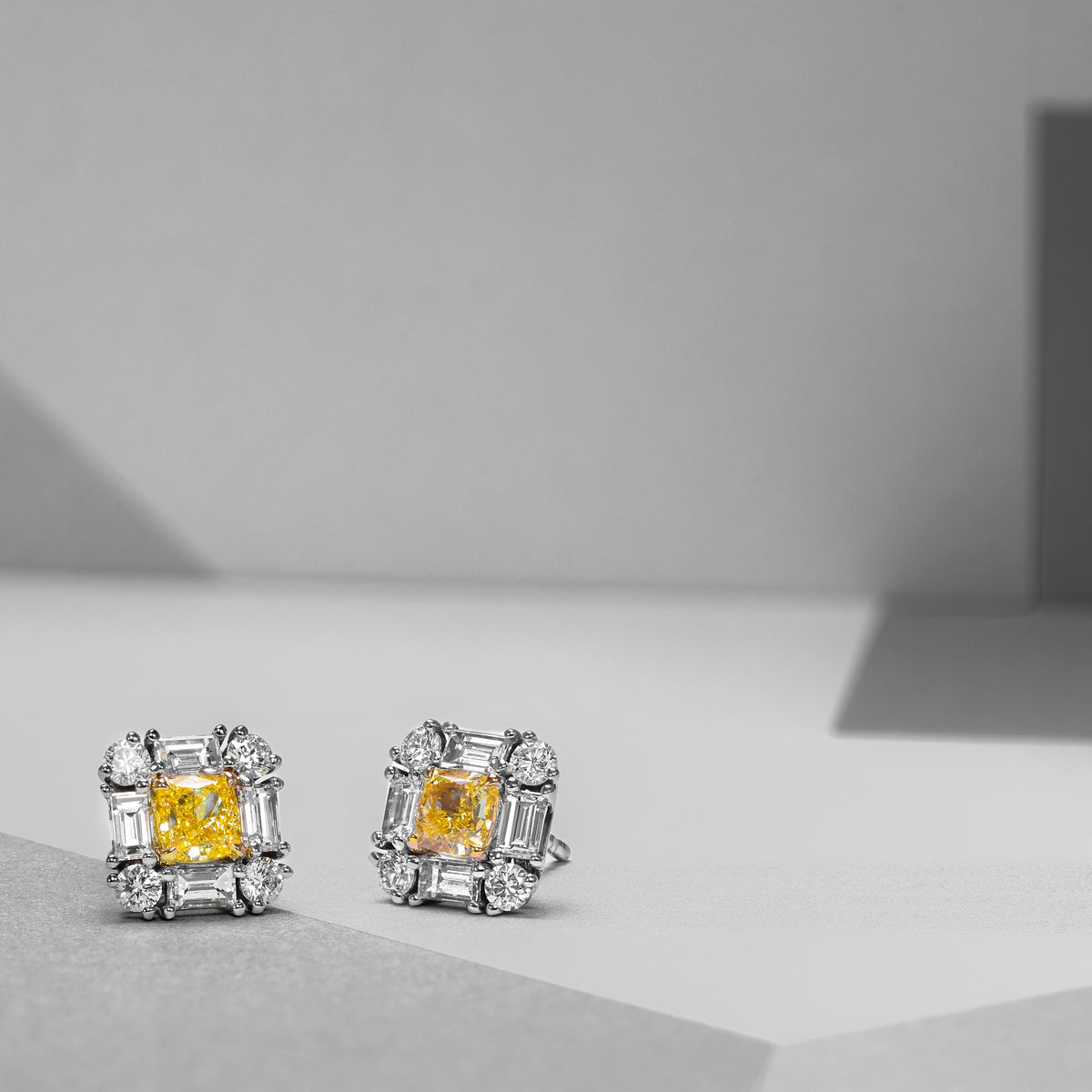 Extraordinary Cushion Fancy Intense Yellow Diamond Halo Stud Earrings