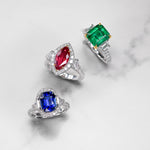 Emerald & Trapezoid Diamond Three-stone Ring