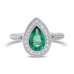 Colombian Emerald and Diamond Halo Side Stone Ring