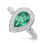 Colombian Emerald and Diamond Halo Side Stone Ring