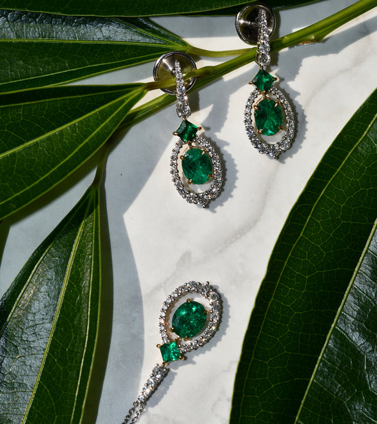 Oval Muzo Emerald and Diamond Halo Pendant