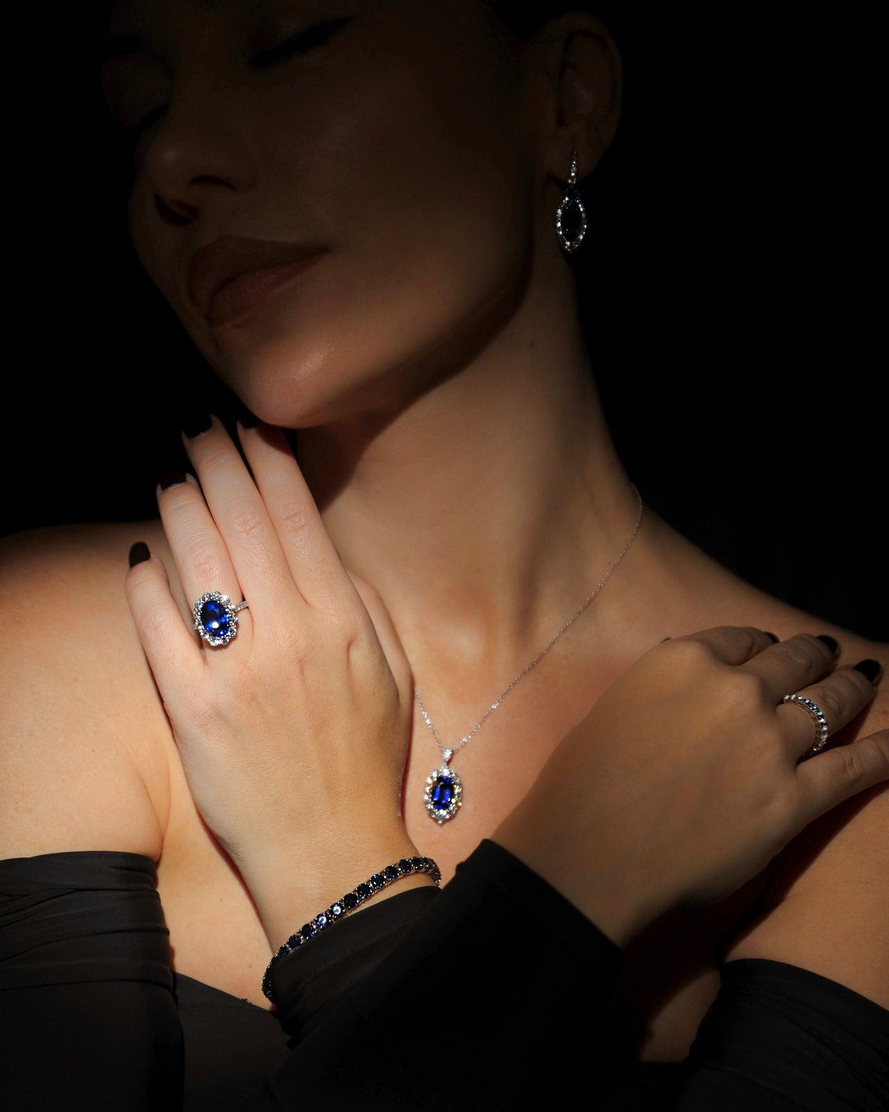 Oval Royal Blue Sapphire and Diamond Halo Ring