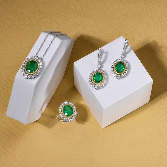 Muzo Oval Emerald and Diamond Double Halo Pendant.