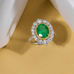 Oval Muzo Emerald and Diamond Double Halo Ring