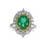 Oval Muzo Emerald and Diamond Double Halo Ring