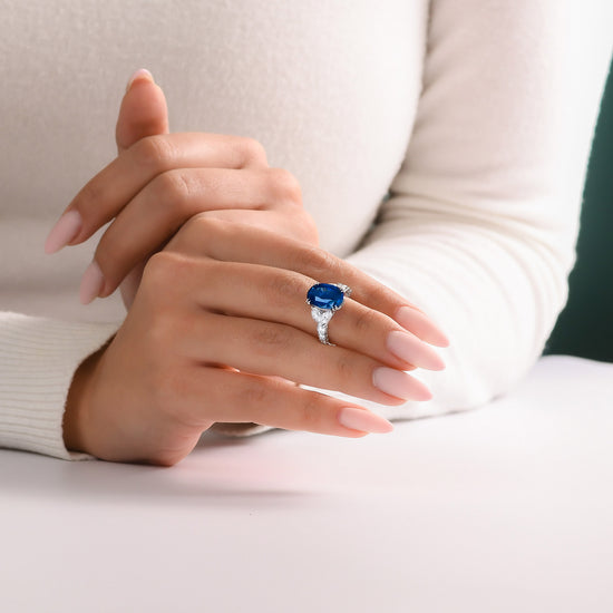 Royal Blue Oval Sapphire and Diamond Side Stone Ring