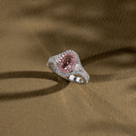 Fancy Pink Brown Oval Three-Stone Halo Diamond Ring