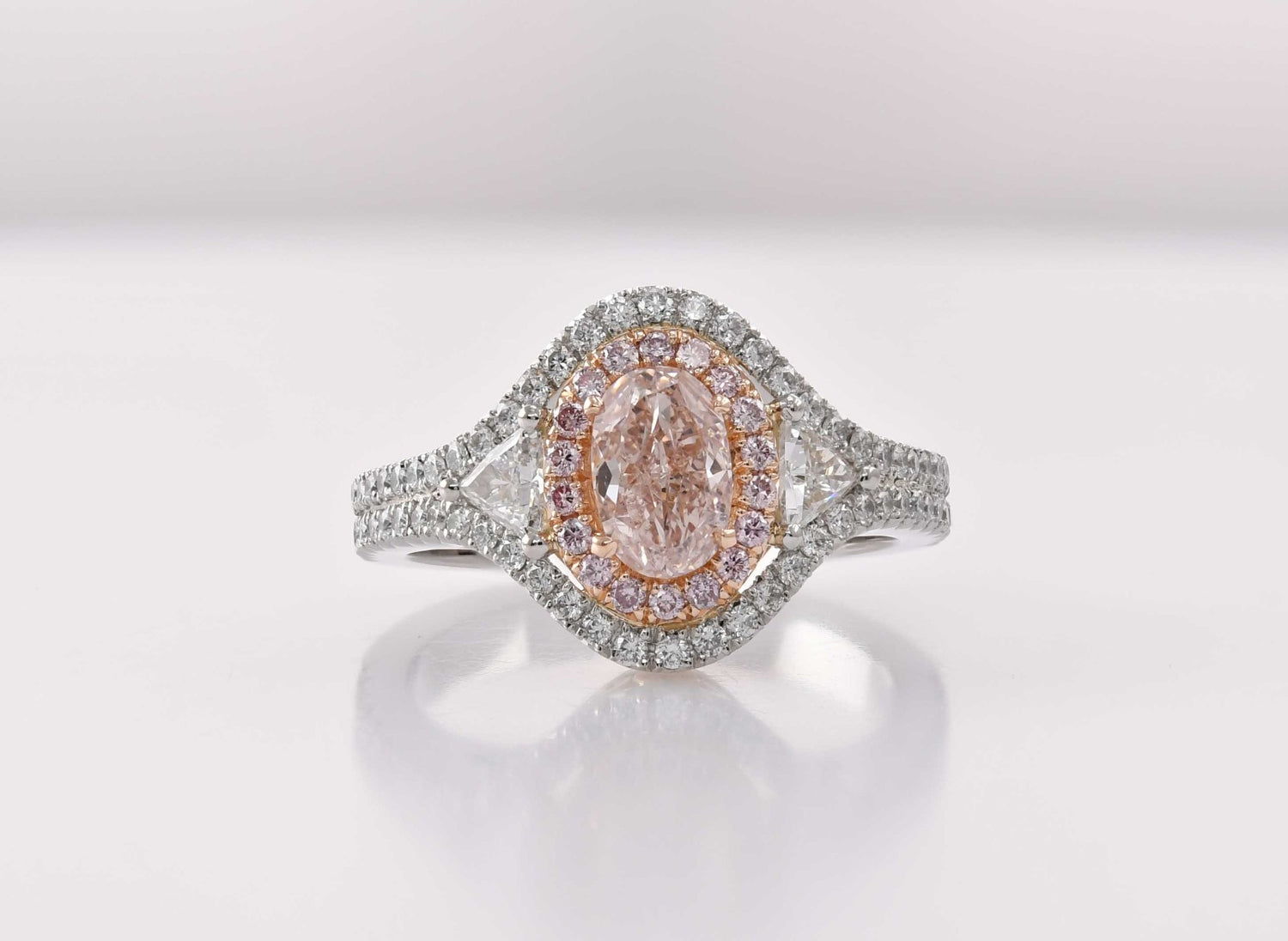 Fancy Pink Brown Oval Three-Stone Halo Diamond Ring