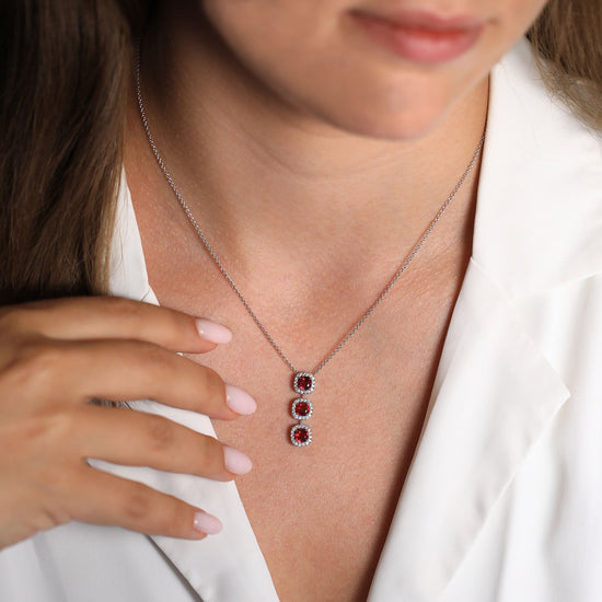 Ruby Cushion and Diamond Three-stone Drop Halo Pendant